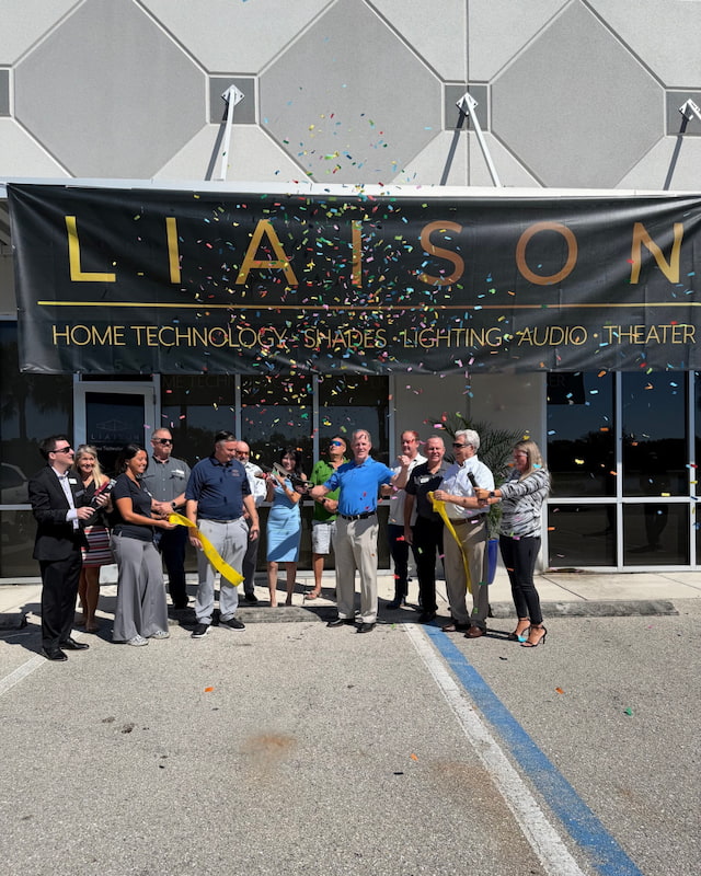 Liaison Technology Group & Chamber representatives celebrate the Fort Myers Design Center opening with a ribbon cutting